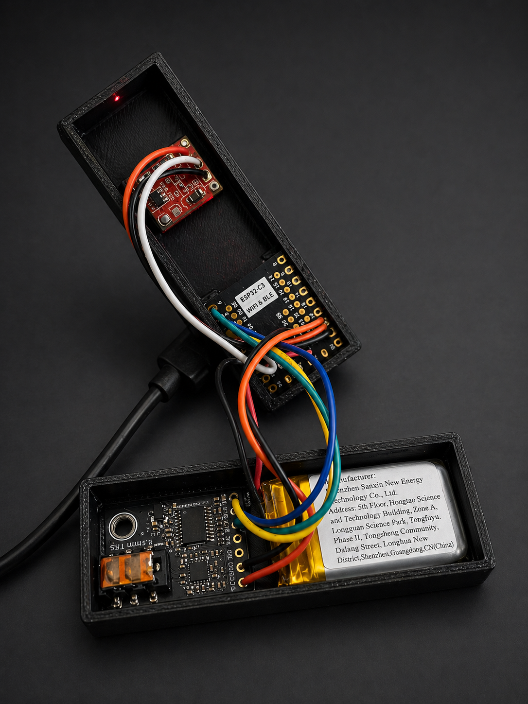 Sendspin Headphones networked DAC device with a headphone cable connected